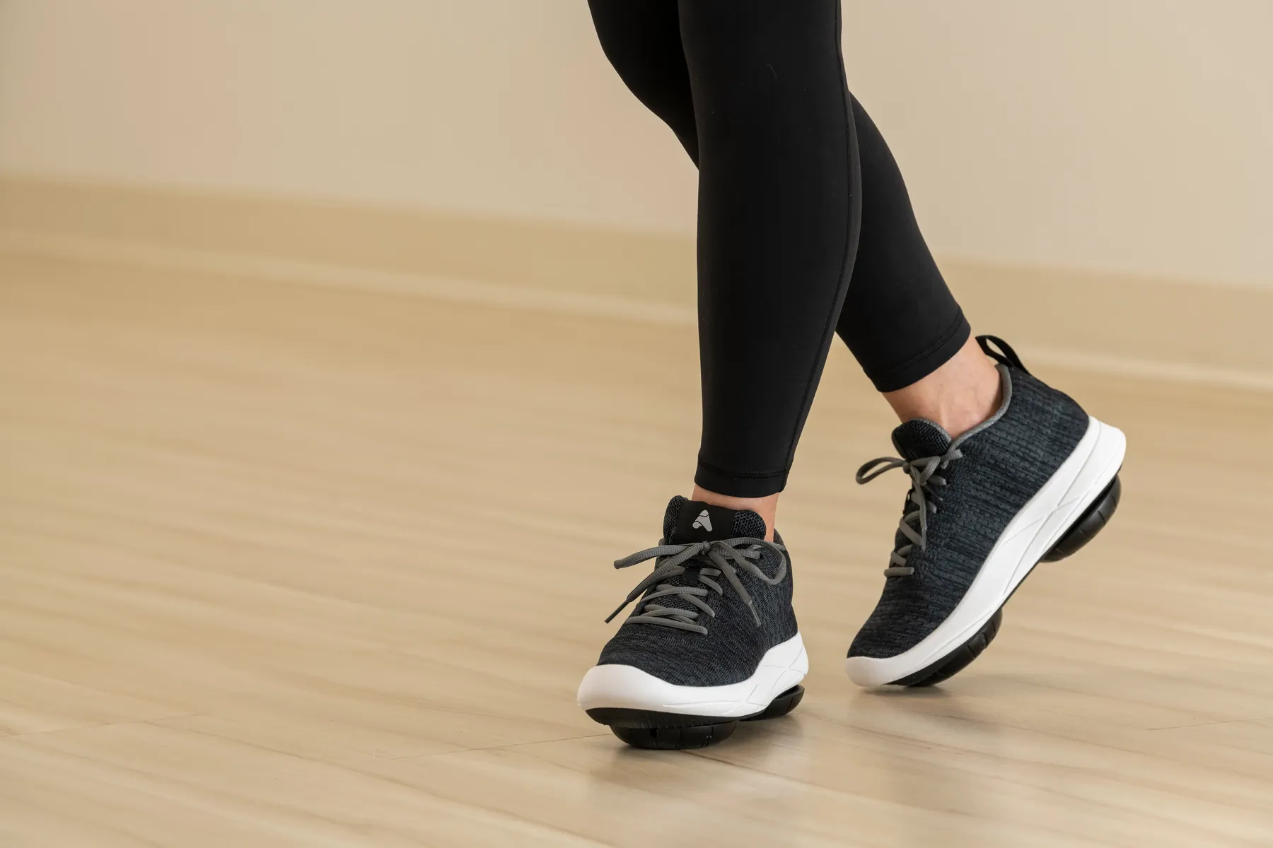 A person walking in Apos® sneakers